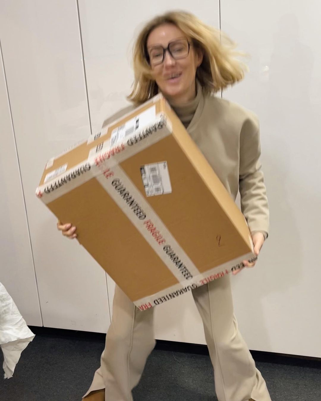 Photo by Optiek Van de Velde on January 10, 2024. May be an image of 1 person, box, suit, carton, office and text.